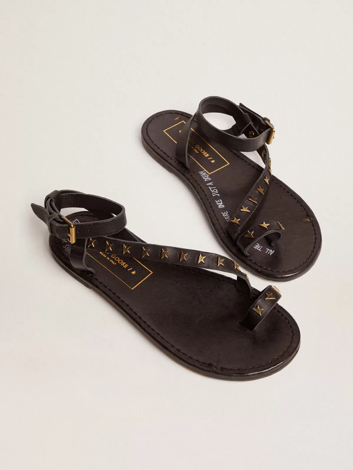 Golden Goose Women's flat sandals in black leather with gold stars New